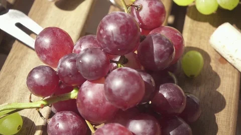 Slow motion the camera is moving along the grapes to the bottle Stock Footage 89086510