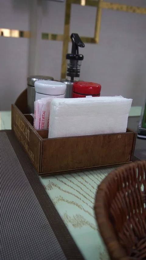 Slow motion camera panning of an elegant restaurant dining table setup with a se Stock Footage 341768214
