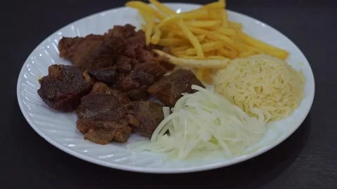 Slow motion camera panning of traditional kazan kebab with roasted meat, crispy  Stock Footage 341464854