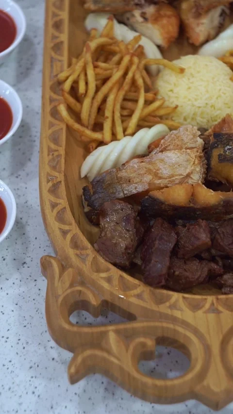 Slow motion camera panning of traditional Central Asian mixed platter with roast Stock-Footage 341465027