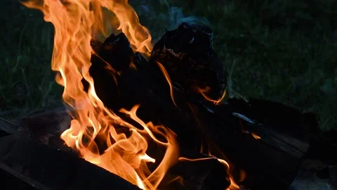 Slow motion of a camp fire burning in the night 動画素材 107314795