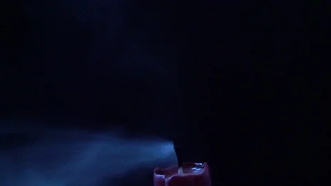 Slow motion of a candle being blown out Stock Footage 124304521