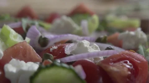Slow motion of caper dropping on Greek Salad Stock Footage 262459677