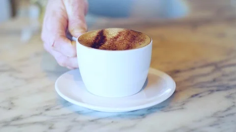 Slow motion cappuccino cup placed onto saucer Stock Footage 102034142