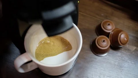 Slow motion of a Capsule coffee machine making cafe latte Stock-Footage 148610367