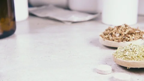Slow motion capsules and tablets fall on the table Stock Footage 93745711