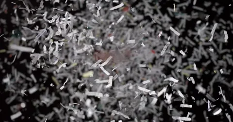 Slow motion capture of flying paper particles Stock Footage 344986531