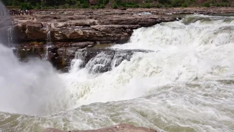 Slow Motion Capture of Spray Rising from Thunderous Waterfall Base 스톡 동영상 304313221