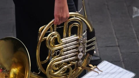 Slow-motion capture of a trombone player at a parade, with a detailed view .. Stock Footage 248953044
