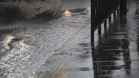 Slow Motion. A car driving over a puddle on a road. Video stock 146250414