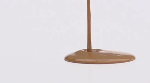 Slow motion caramel pouring Stock Footage 33801317