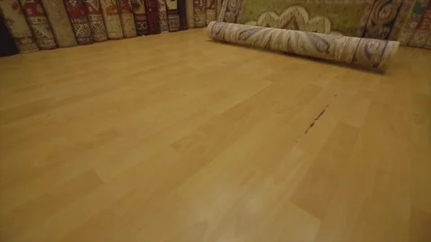 Slow motion carpet opening on ground in grand bazaar istanbul Stock Footage 114709167