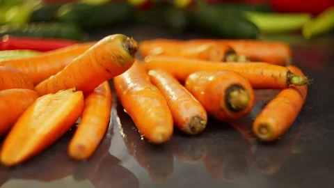 Slow Motion Carrot Falling on Table Stock Footage 296362106