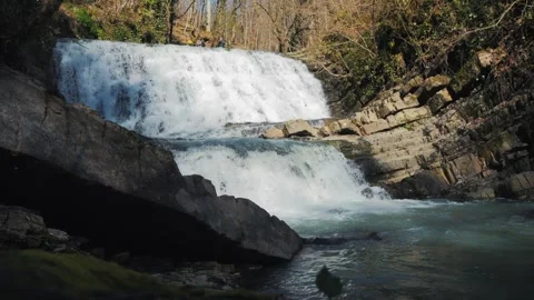 Slow Motion: Cascading Forest Waterfall with Slider Motion in Sochi Stock Footage 270458899