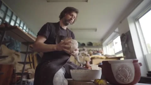 Slow motion. Ceramics studio. Potter at work Video stock 143377011