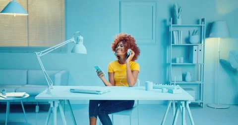 Slow motion of cheerful young black woman with afro hairstyle relaxing and Stock Footage 164382822
