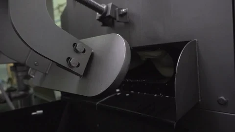 Slow-motion of cheese flow out from a machine Stock Footage 129928200