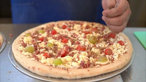 Slow motion of a chef cook spreading chopped bacon on creative and Stock Footage 242526063