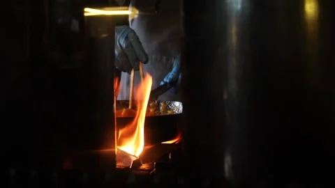 Slow Motion of Chef Cooking with Fire Under Pan in Commercial Kitchen Stock Footage 304910694