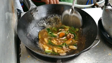 Slow motion, Chef cooking Fried noodle with seafood and vegetable Stock Footage 109247996