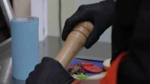 Slow motion of Chef Cooking in the Kitchen, Restaurant wok fire cooking Close up Vídeo Stock 142878131
