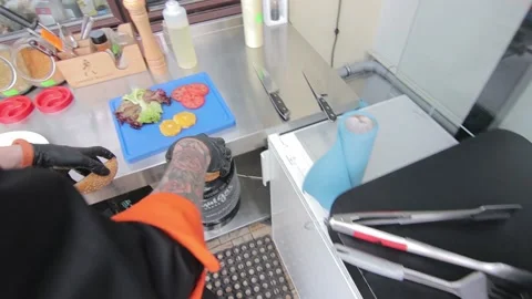 Slow motion of Chef Cooking in the Kitchen, Restaurant wok fire cooking Close up Видео 142880368