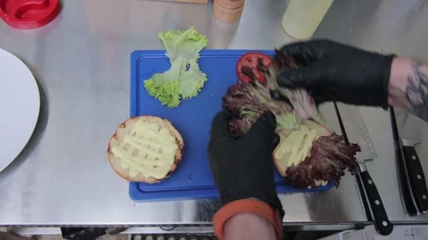 Slow motion of Chef Cooking in the Kitchen, Restaurant wok fire cooking Close up Stock Footage 142890219