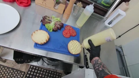 Slow motion of Chef Cooking in the Kitchen, Restaurant wok fire cooking Close up Stock Footage 142897339