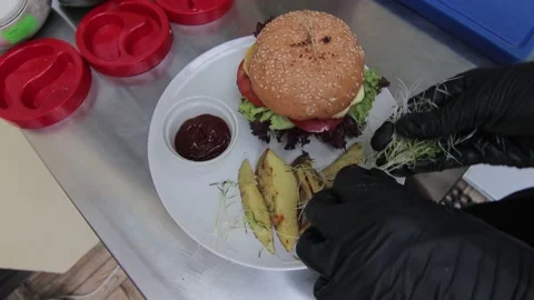 Slow motion of Chef Cooking in the Kitchen, Restaurant wok fire cooking Close up Video stock 142898797