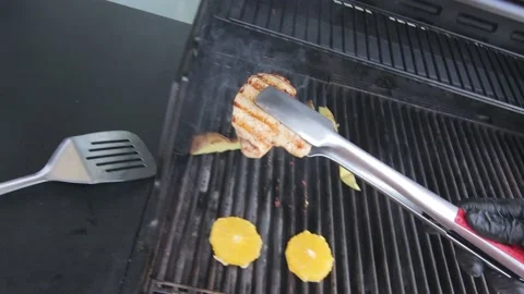 Slow motion of Chef Cooking in the Kitchen, Restaurant wok fire cooking Close up Video stock 142899071