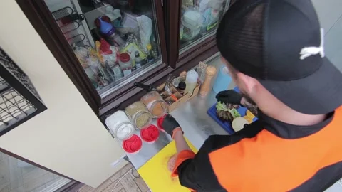 Slow motion of Chef Cooking in the Kitchen, Restaurant wok fire cooking Close up Stock Footage 142899932