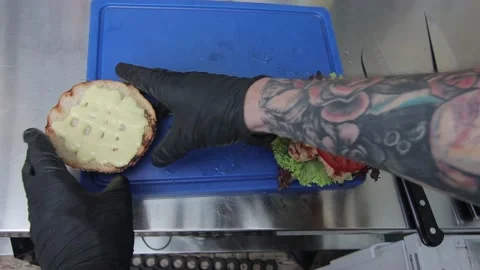 Slow motion of Chef Cooking in the Kitchen, Restaurant wok fire cooking Close up Stock Footage 142901340