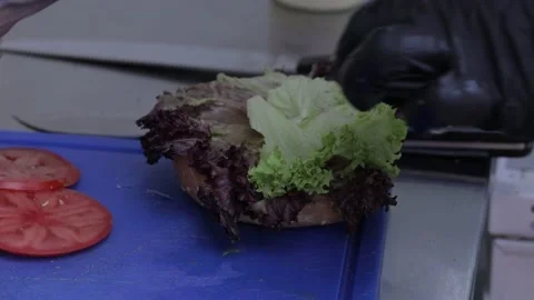 Slow motion of Chef Cooking in the Kitchen, Restaurant wok fire cooking Close up Stock Footage 142904086