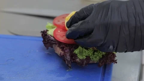 Slow motion of Chef Cooking in the Kitchen, Restaurant wok fire cooking Close up Stock Footage 142904728