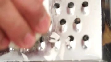 Slow motion Chef Grating Coconut pulp Stock Footage 85810750