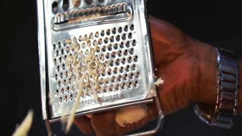 Slow motion chef grating parmesan cheese to make a delicious tortilla Stock Footage 230080454