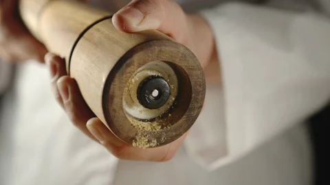 SLOW MOTION: Chef Grinding Spice In A Wooden Grinder While Cooking Stock Footage 118788722