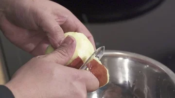 Slow motion Chef Peeling an Apple Stock Footage 85850586