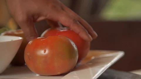 Slow motion of a chef picking a tomato Stock Footage 128093996