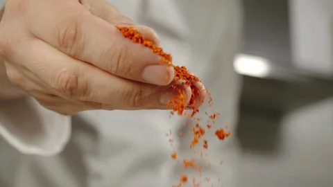 SLOW MOTION: Chef Sprinkles Red Pepper Powder While Cooking 스톡 동영상 113990836
