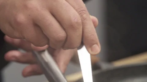Slow motion Chef stirring a preparation in a saucepan Stock Footage 85885729