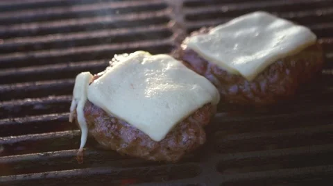 SLOW MOTION: chef takes two burgers from the grill Stock Footage 53344263