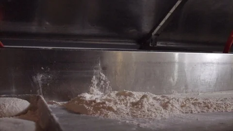 Slow Motion of a Chef Tossing Pizza Dough Onto Flour Stock Footage 91044170