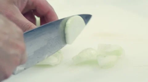 Slow motion. The chef's knife to cut onions on a cutting Board Stock-Footage 68924714