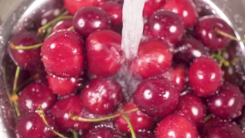 Slow motion cherry in colander under water Stock Footage 90650642