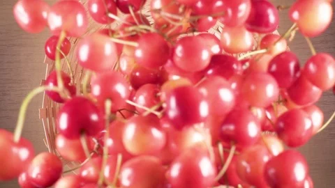 Slow motion cherry falls down into a wicker basket Stock-Footage 90488086