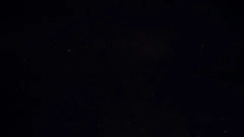 Slow motion of cherry tomatoes falling into water on a black background. Stock Footage 109343482