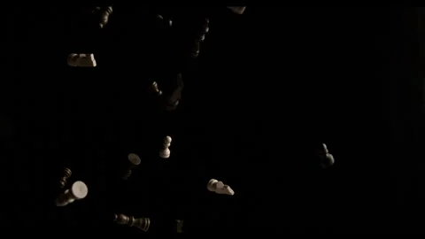 Slow Motion of Chess Pieces Being Thrown Into the Air Against a Black Backdrop Stock-Footage 270403734