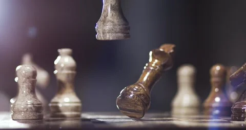 Slow motion chess pieces fall in high speed recording Stock Footage 340482429