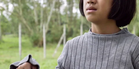Slow motion of child holding leaf fan Stock Footage 162117298